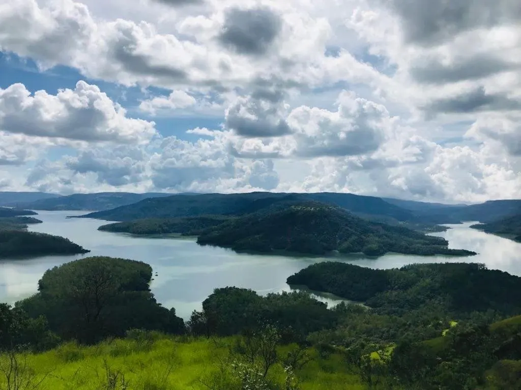 Shivsagar Lake winding between the green hills of Tapola